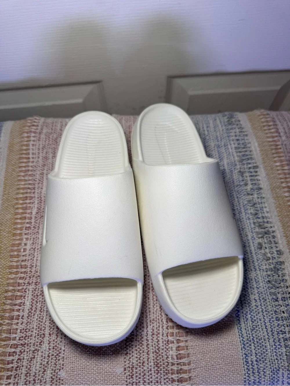 Nike Calm White Slide Sandals.